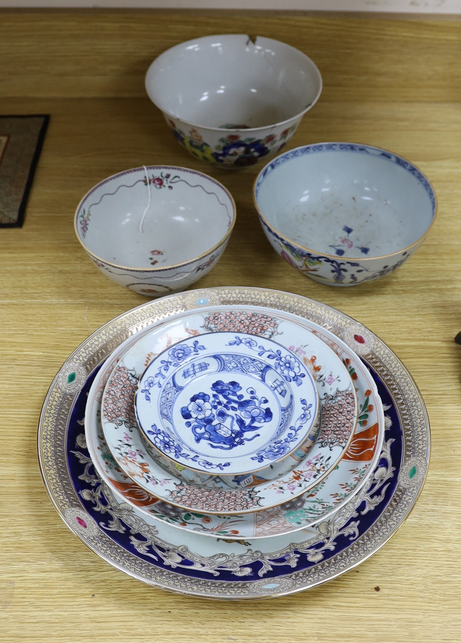 A group of 18th century and later Chinese enamelled and blue and white porcelain dishes and three bowls, Largest dish 35.5 cm diameter